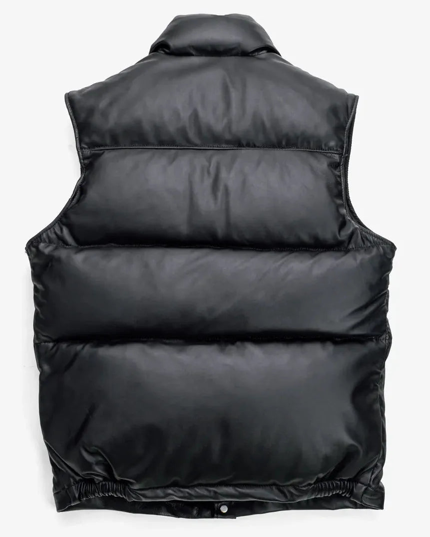 back showcase of the Leveljacket Matte Black leather quilted puffer vest, detailing its wide horizontal thermal baffles, high insulated stand-up collar, front vertical zipper pockets, snap-button closure placket, and elasticated lower back hem.