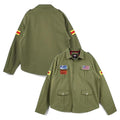 A promotional graphic for the Leveljacket Silent Hill 2 James Jacket showcasing a model wearing the green cotton field coat on the left, a back view panel on the upper right, and close-up panels of the game-accurate embroidered American flag, text patches, and yellow-red sleeve stripes on the lower right.