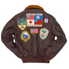 back view of the Leveljacket Top Gun G-1 leather flight jacket in dark brown, showing a plush brown fur collar, front utility button pockets, and a comprehensive collection of 17 embroidered military and squadron patches across the chest and back panel."
