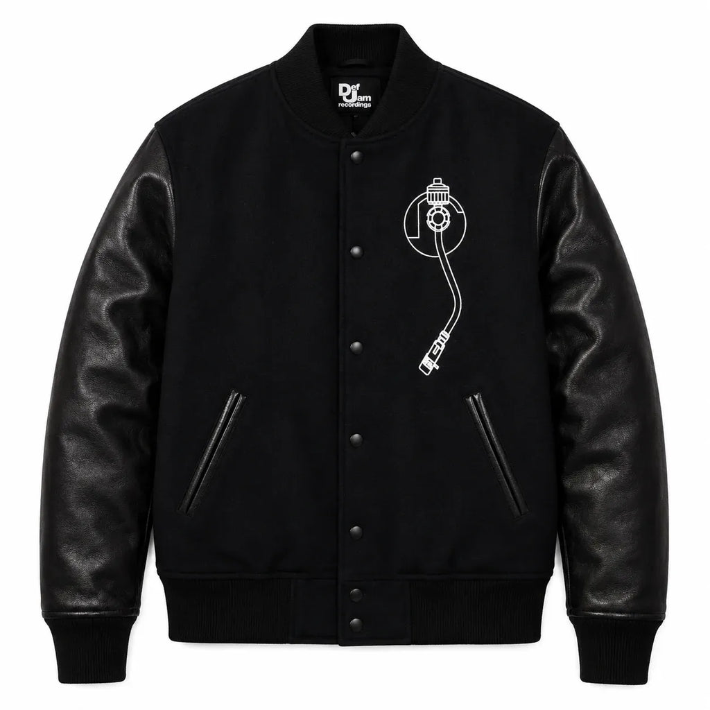 Front and back catalog layout of the Leveljacket Def Jam Recordings black varsity jacket, displaying a premium black wool body with black leather sleeves, custom white embroidered turntable needle art on the front chest, and a bold white Def Jam Recordings typography patch layout across the back.
