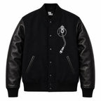 Front and back catalog layout of the Leveljacket Def Jam Recordings black varsity jacket, displaying a premium black wool body with black leather sleeves, custom white embroidered turntable needle art on the front chest, and a bold white Def Jam Recordings typography patch layout across the back.