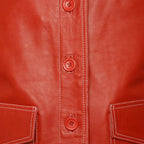 Zoom Front views of the Leveljacket Tyler Durden Fight Club red leather jacket, showcasing its prominent 1970s wide lapels, 4-button front closure, large flap waist pockets, and detailed white contrast seam stitching.