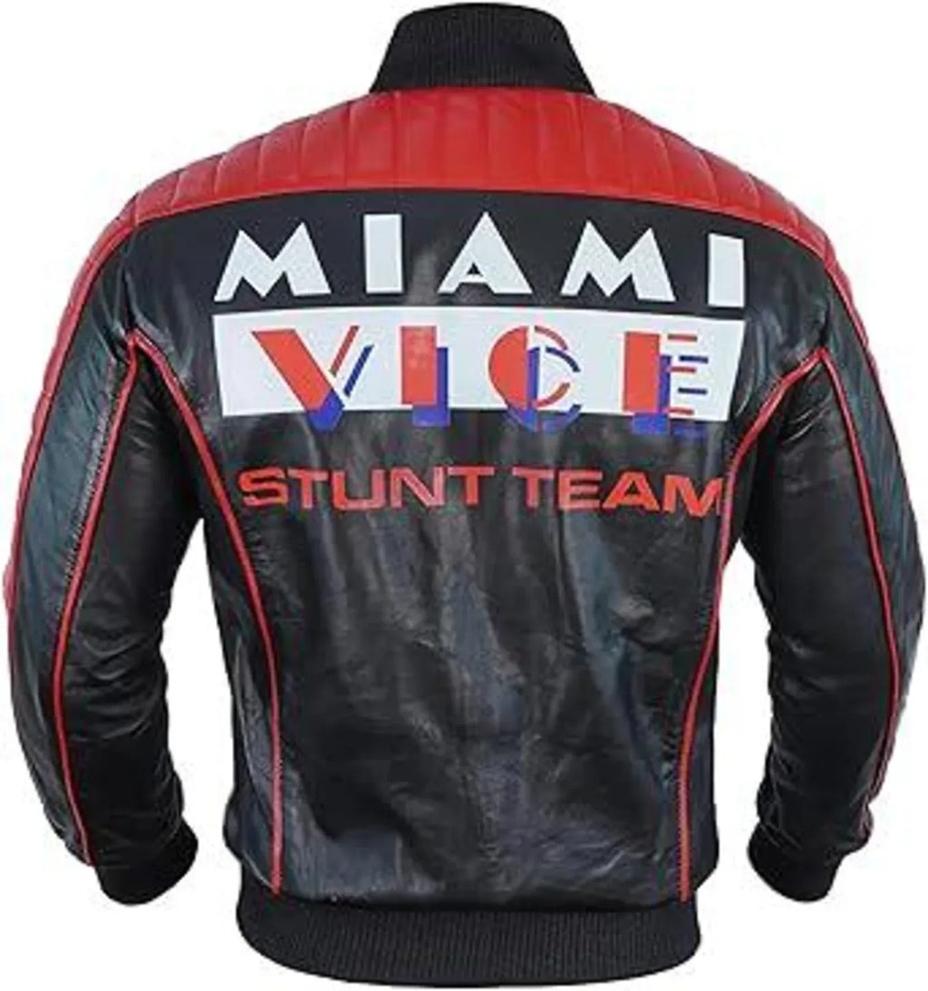 Back view of a black leather jacket with red shoulder panels and red piping, featuring a large 'MIAMI VICE STUNT TEAM' graphic on the back.