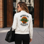 Woman wearing a white jacket with 'MIYAGI-DO KARATE' design, walking on a street.