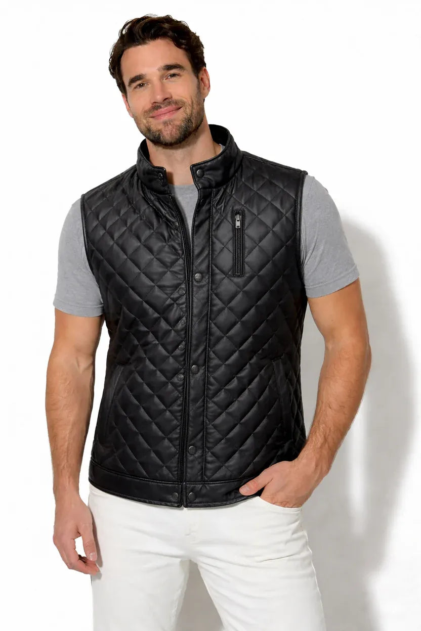 Man wearing a black quilted vest on a white background