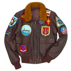 Front and back view of the Leveljacket Top Gun G-1 leather flight jacket in dark brown, showing a plush brown fur collar, front utility button pockets, and a comprehensive collection of 17 embroidered military and squadron patches across the chest and back panel."