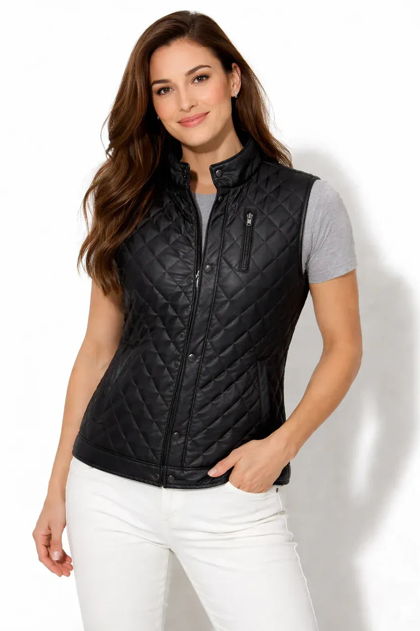 Woman wearing a black quilted vest on a white background